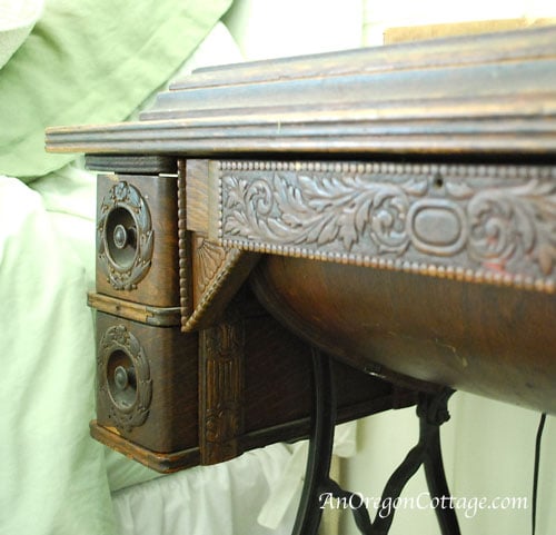 carving on drawers of antique machine
