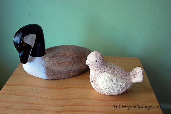 bird figurines before thrift store animals