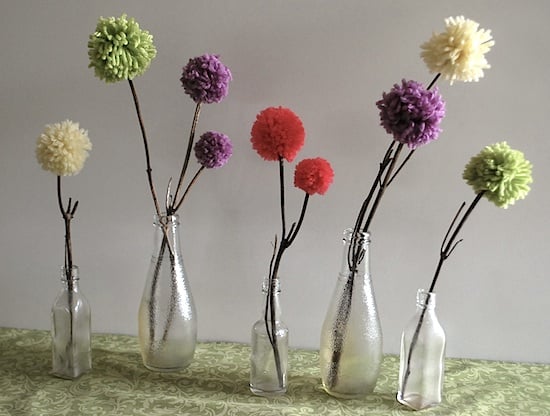 pom flowers in bottles